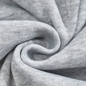 Macro view of soft grey heathered fleece fabric texture for men's hoodies.