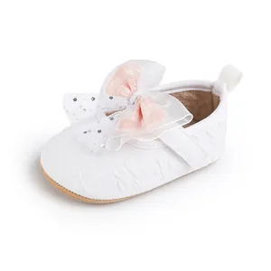 Elegant white baby walking shoe for 0-1 year olds with a pink sequined bow detail.