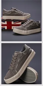 Vista detallada de zapatillas de lona gris para hombre con suela blanca texturizada
