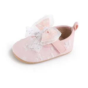 Close-up of pink baby walking shoe with large mesh bow for 0-1 year infants