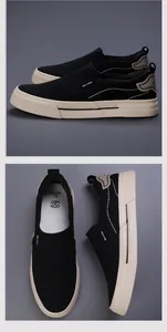 Detailed view of men's black canvas slip-on shoes with comfortable flat soles