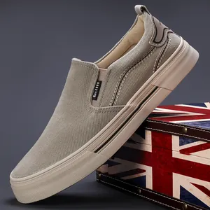 Casual men's slip-on canvas loafers in beige with breathable fabric and flat sole