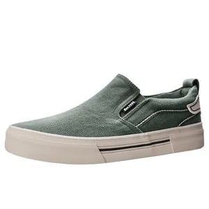 Men's casual sage green canvas slip-on shoes featuring comfortable flat cream rubber sole