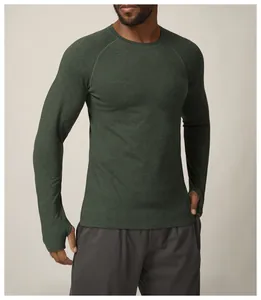 Close-up of men's green quick-dry athletic long sleeve shirt with thumbhole cuffs