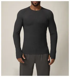 Detail shot of men's charcoal grey slim fit athletic long sleeve shirt with thumbholes