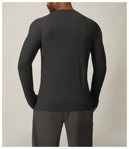 Back view of a men's slim-fit quick-dry long-sleeve athletic shirt in dark gray