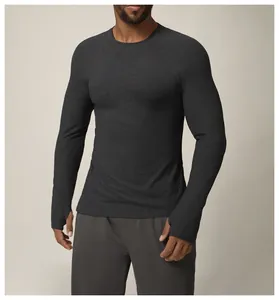 Detail of charcoal grey long-sleeve fitness top with thumbholes for men