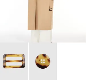Detail view of high-end tortoise shell patterned urea buckle and round button for coats.