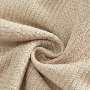 Vista macro del tessuto in maglia jacquard pesante 300g con trama morbida