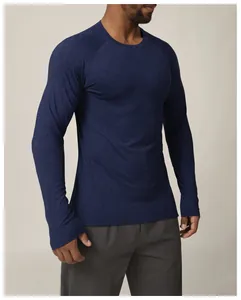 Macro view of blue long-sleeve athletic shirt showing breathable fabric texture