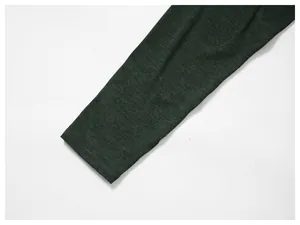 Close-up of heather green athletic long-sleeve cuff showing fabric texture.