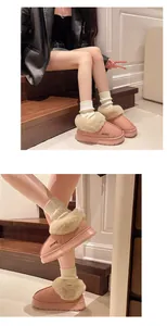 Bottes de neige roses doublées de fourrure avec semelles plateforme sur un mannequin