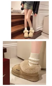 Gros plan de bottes de neige beiges à plateforme avec fourrure et broderie.
