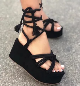 Detailed macro view of black rope straps and platform sole on fashionable sandals