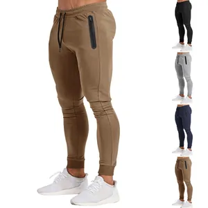 Detailed side view of slim fit men's joggers in khaki featuring a zipper thigh pocket