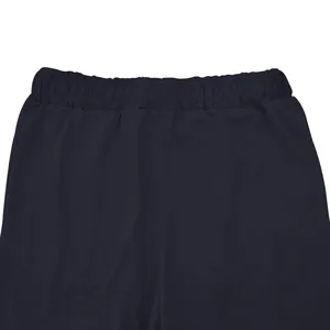 Detailed view of elastic waistband on men's stretchy navy athletic fitness pants