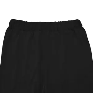 Close-up detail showing the elastic waistband of black men's casual elastic sports pants