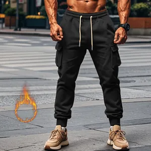 Detail view of men's thermal fleece cargo pants with multi-pockets and ribbed cuffs