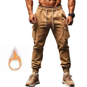 Detail of men's camel cargo sweatpants with fleece lining and multiple utility pockets.