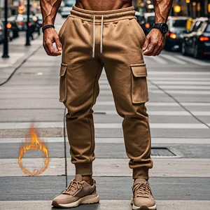 Men's khaki fleece-lined cargo joggers with drawstring waist and pockets in urban setting
