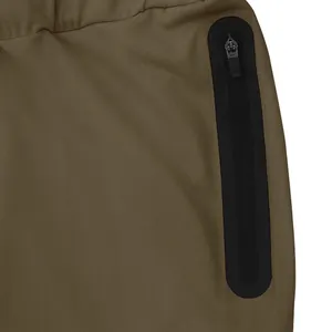 Close-up detail of a vertical black heat-sealed zipper pocket on khaki men's joggers.