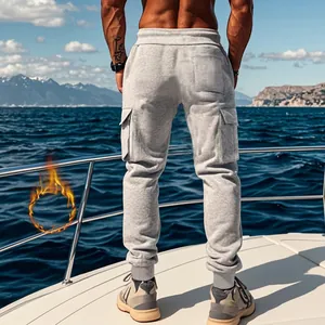 Back view of men's thermal grey cargo joggers with multiple pockets on a sunny boat deck