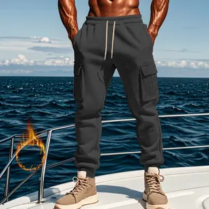 Men's thermal fleece-lined cargo pants in dark grey with multi-pockets on a boat