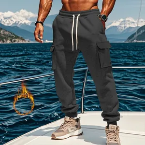 Men's fleece-lined cargo sweatpants showcased in an outdoor nautical environment on a yacht