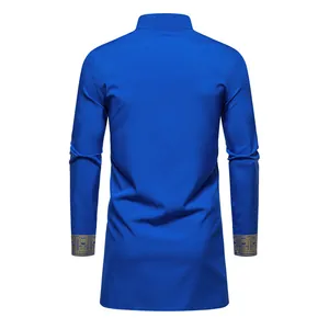 Detail of a men's blue ethnic long tunic shirt with gold print cuffs, back view.