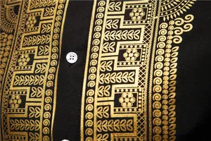 Macro view showing the intricate gold foil print on this men's black ethnic style robe