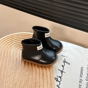 Toddler black soft-sole walking boots for autumn, featuring minimalist Korean design