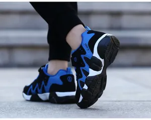 Detailed back view of durable blue and black non-slip athletic running shoes for boys