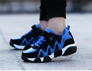 Detailed side view of blue and black durable athletic sneakers for boys aged 7-12 years