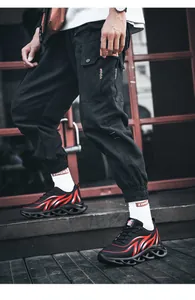 Close-up of men's mesh lightweight casual sneakers with red flame pattern