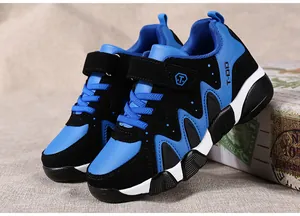 Durable blue and black leather sports shoes for boys with non-slip soles and velcro.