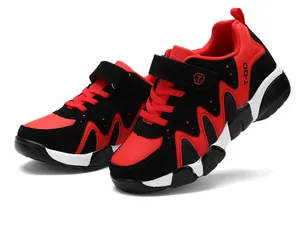 Side view of red and black boy's athletic running shoes with hook-and-loop closure