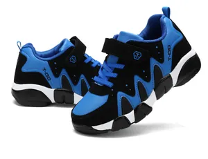 Close-up view of durable blue and black boys' sports shoes with hook-and-loop straps