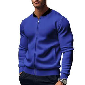 Detail of a men's blue stand-collar bomber jacket with a textured twill fabric finish