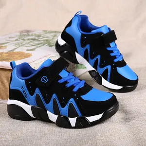 Durable blue and black boys' running shoes with velcro straps for children aged 7 to 12.