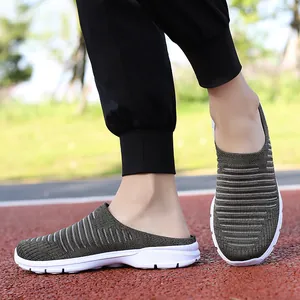 Detailed close-up of army green breathable fly-knit outdoor slippers with white sole
