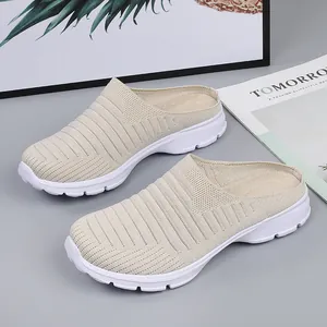 Breathable knitted mules for women with thick white anti-slip soles in beige color.