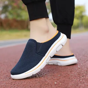Detailed close-up view of navy blue breathable mesh half-slippers worn on outdoor track