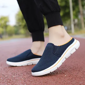 Breathable navy blue mesh mules with orange accents for outdoor travel and walking