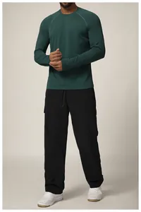 Detailed look at the seamless men's athletic quick-dry long sleeve shirt in teal.