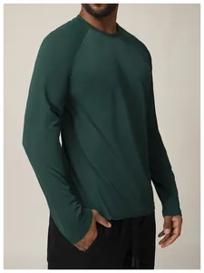 Close-up of seamless dark green men's athletic long sleeve shirt showing mesh texture