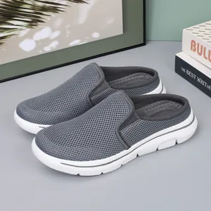 Breathable grey mesh mules with lightweight white sole for comfortable outdoor travel
