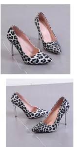 Detailed view of leopard print high-heeled pumps with pointed toes and stiletto heels.