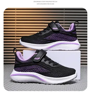 Detail view of breathable mesh girl's running shoes in black and purple finish.