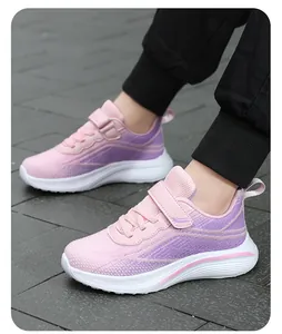 Detailed side view of pink and purple breathable mesh sneakers for girls in a casual outdoor setting