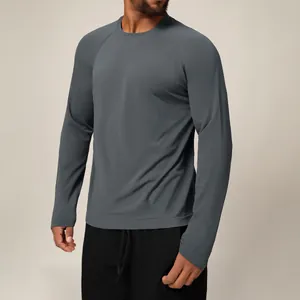 Men's grey quick-dry long sleeve athletic t-shirt with breathable mesh texture on model